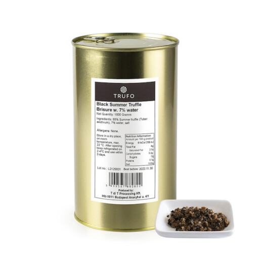 1-2 Taste Trufo - Black summer Truffle Brisure 7% packaged in a gold tin, labeled with ingredient and nutrition details, alongside a white dish displaying the coarsely chopped truffle blend